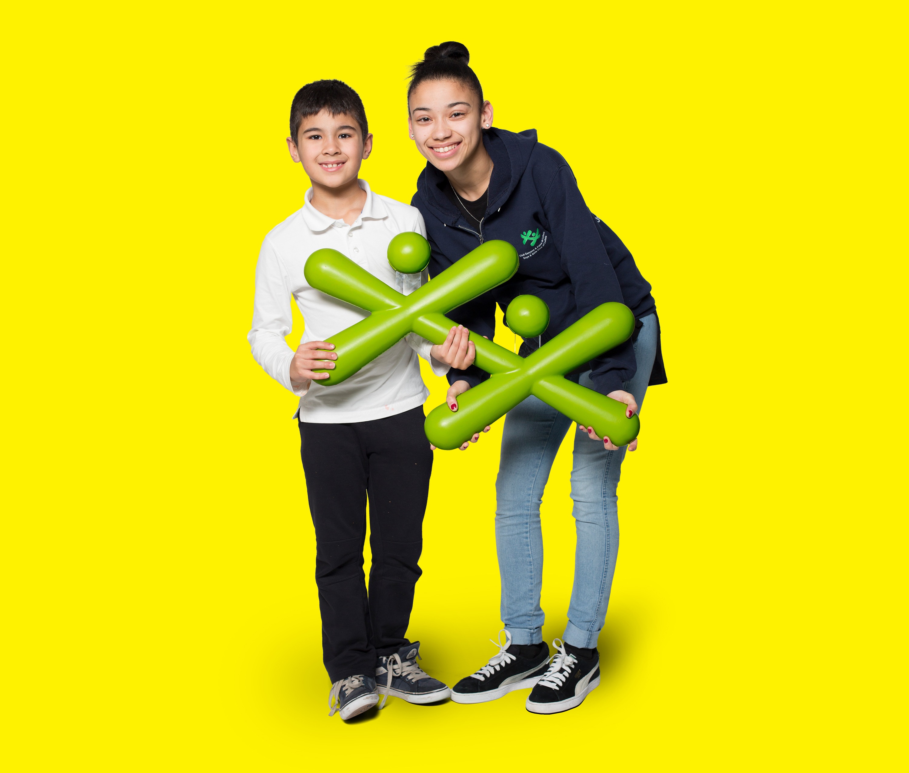 A portrait picture of a youth and volunteer holding the BGC logo