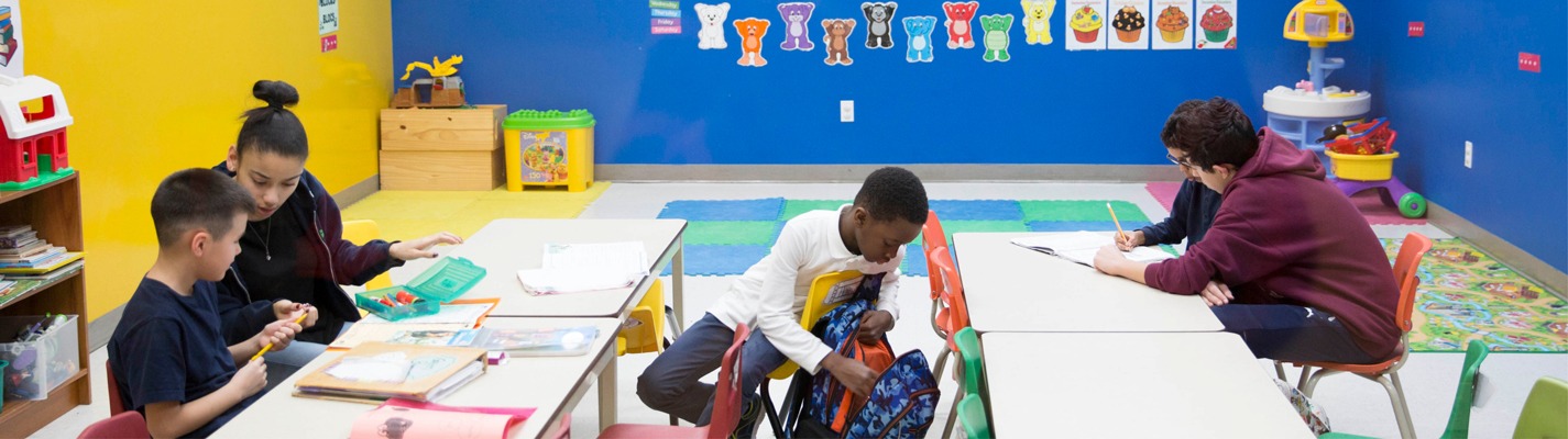 Youth getting homework help from mentors