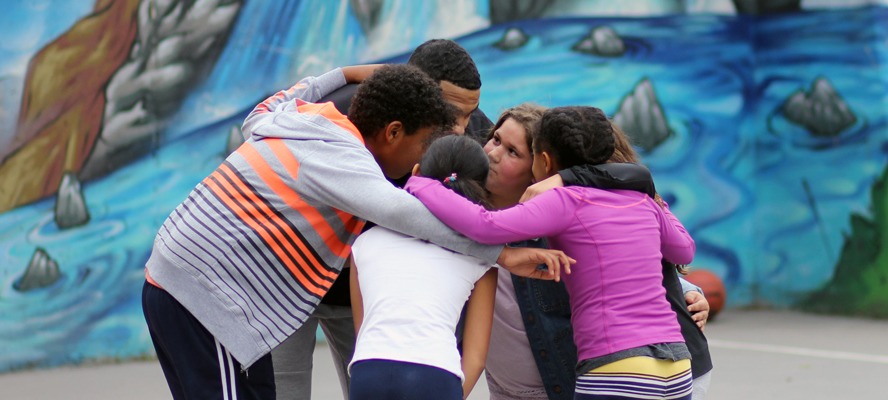 Group of youth huddling together