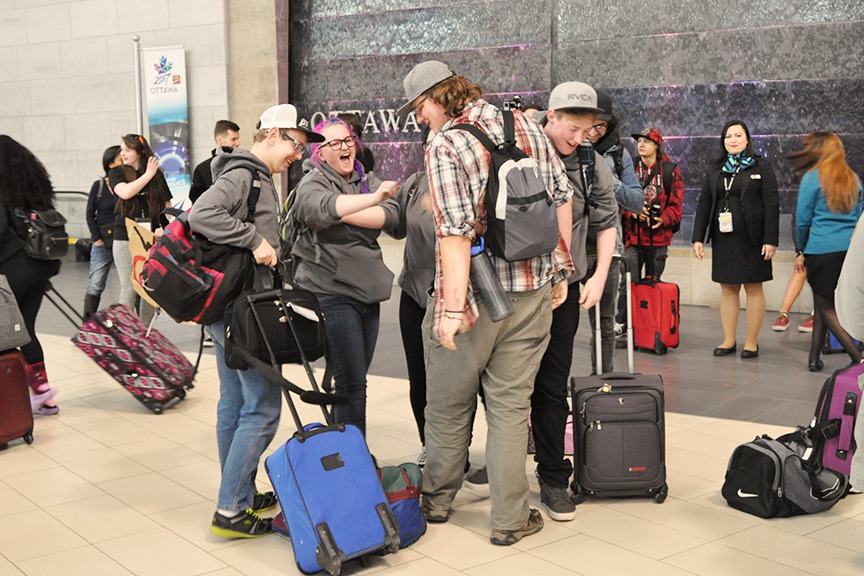 Youth greeting each other at the Ottawa airport